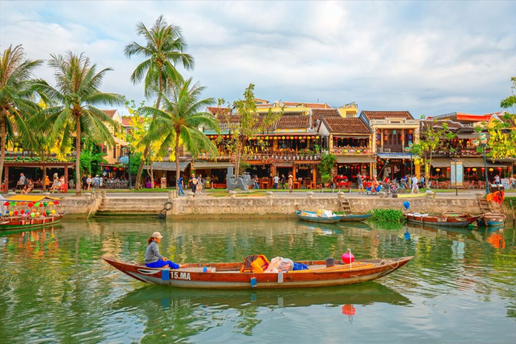 Boats on canal in front of Hoi An Village