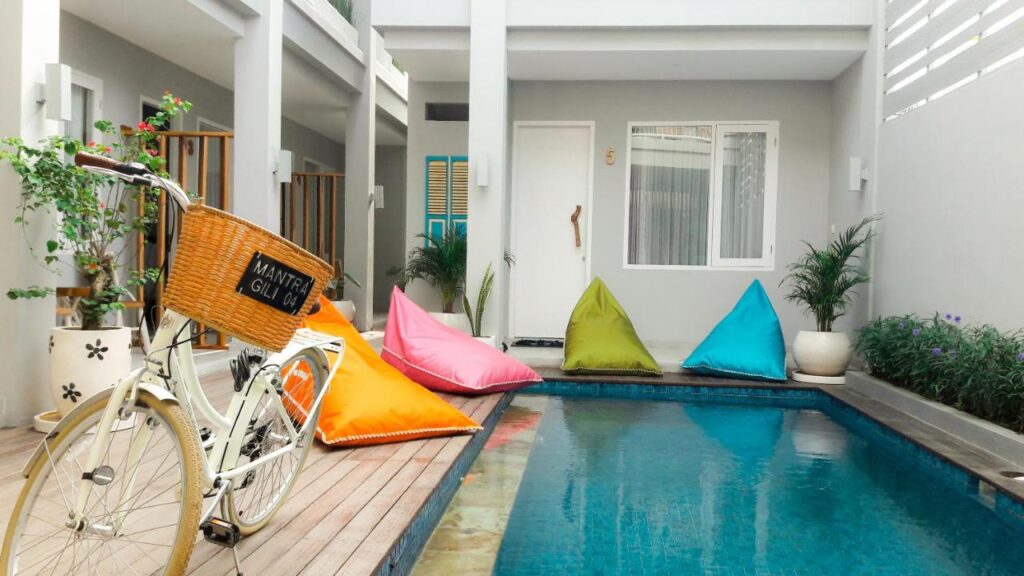 indoor pool with a bike and air beds