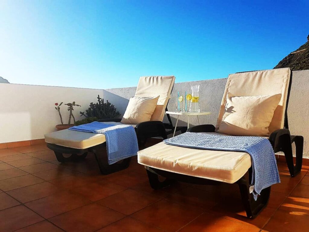 two sun loungers at the terrace of the hotel