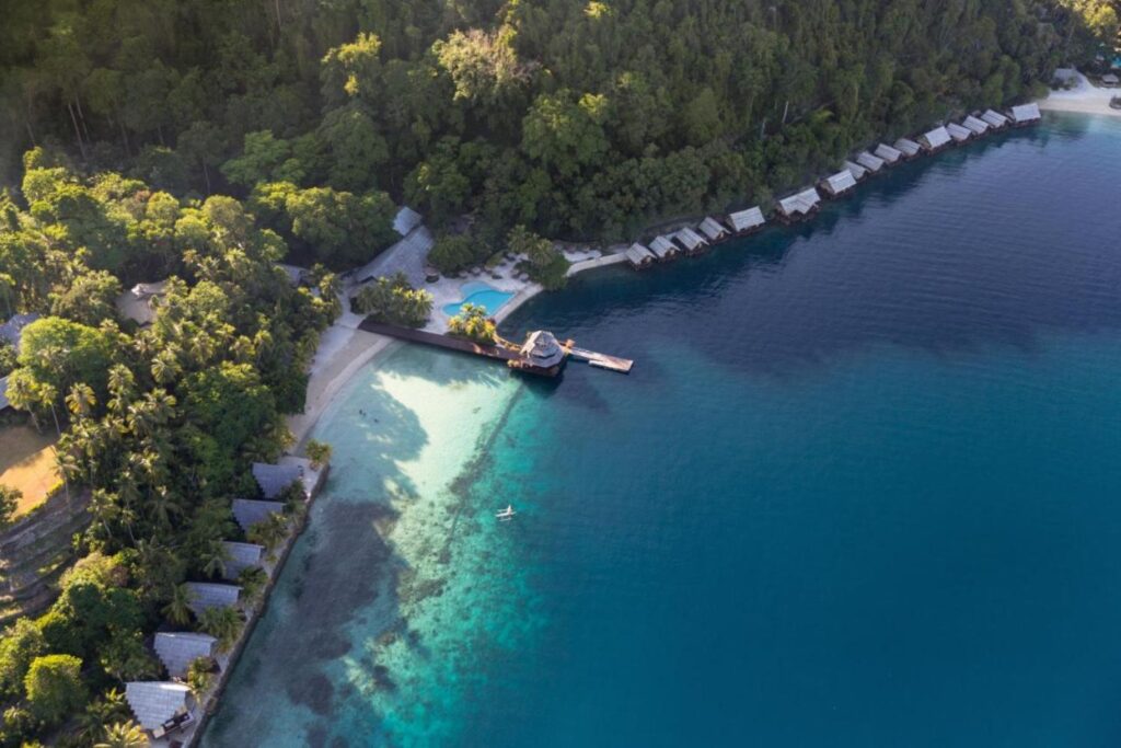 aerial view of overwater bungalows with winding overwater walkways in Samal Island