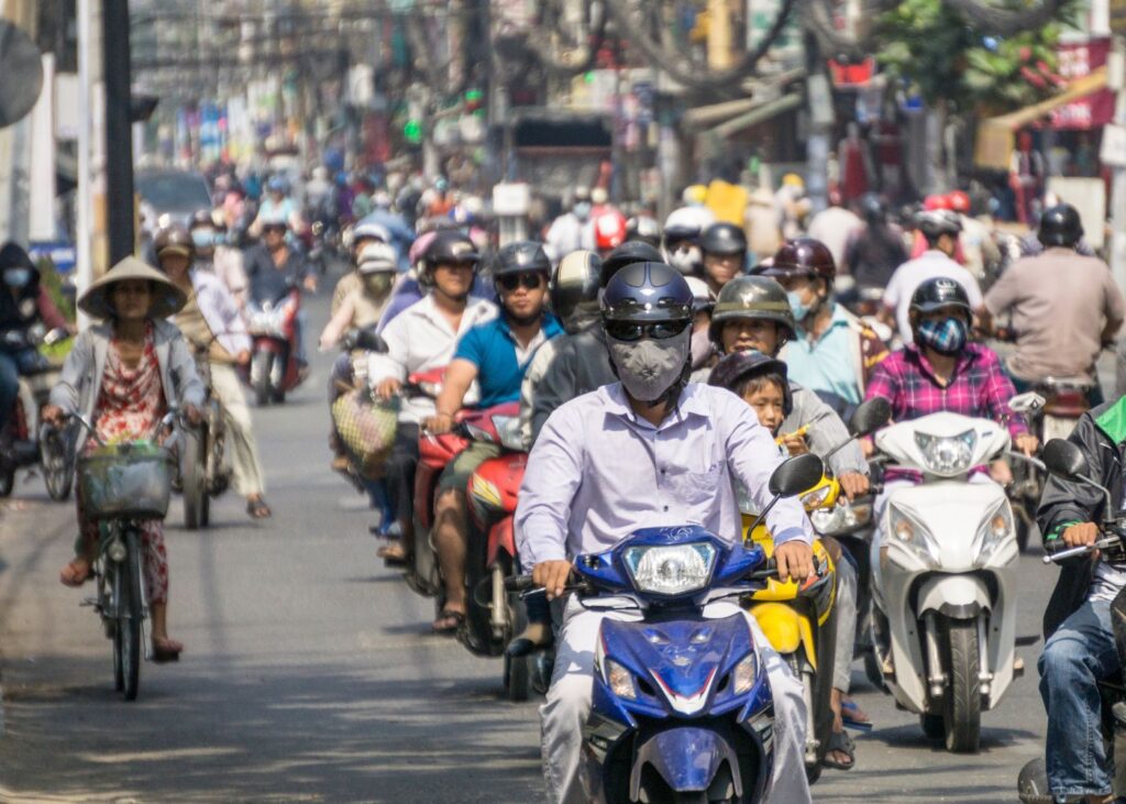 Picture of traffic in Vietnam with motobikes and bicycles