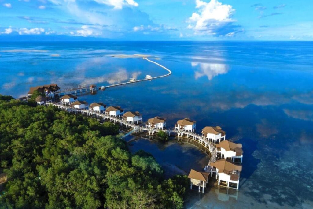aerial view of floating villas attached to a meandering dock