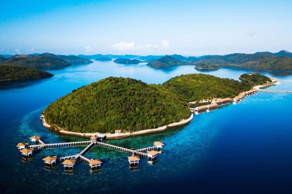 aerial view of private water cottages on an island