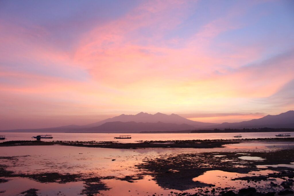 beautiful sunrise in Gili Air with the view of the beach and mountains