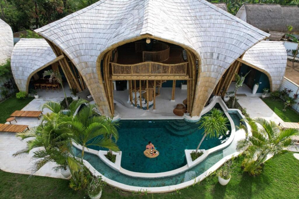 aerial view of a beautiful villa with a private pool