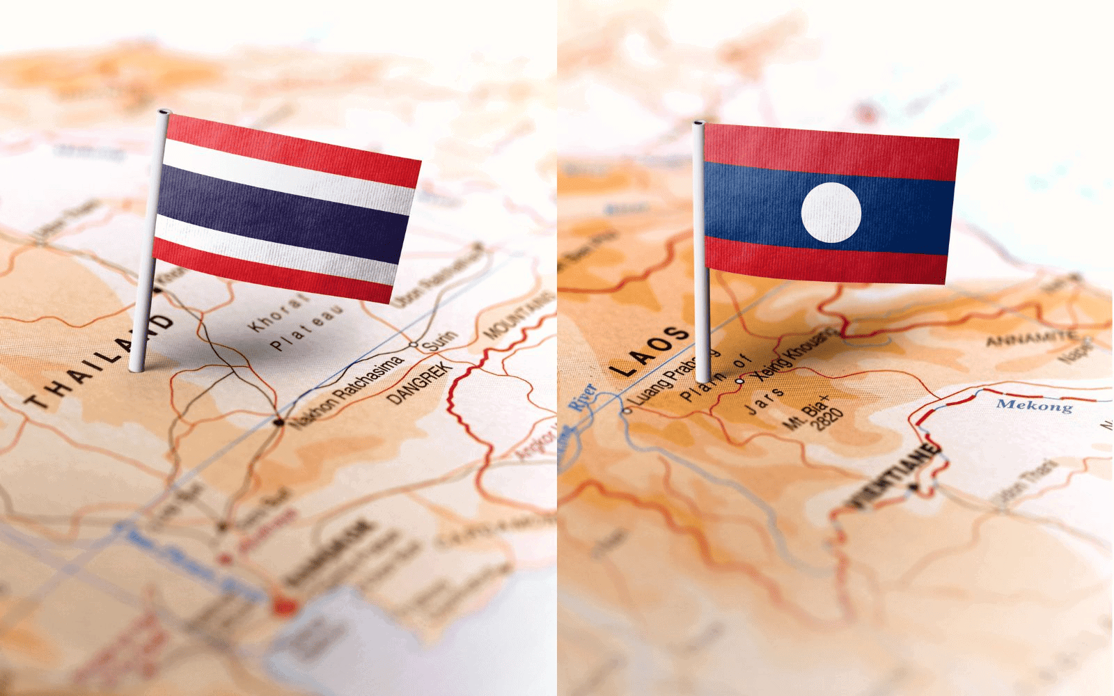 Thail map with Thai flag next to Lao map with Laos flag
